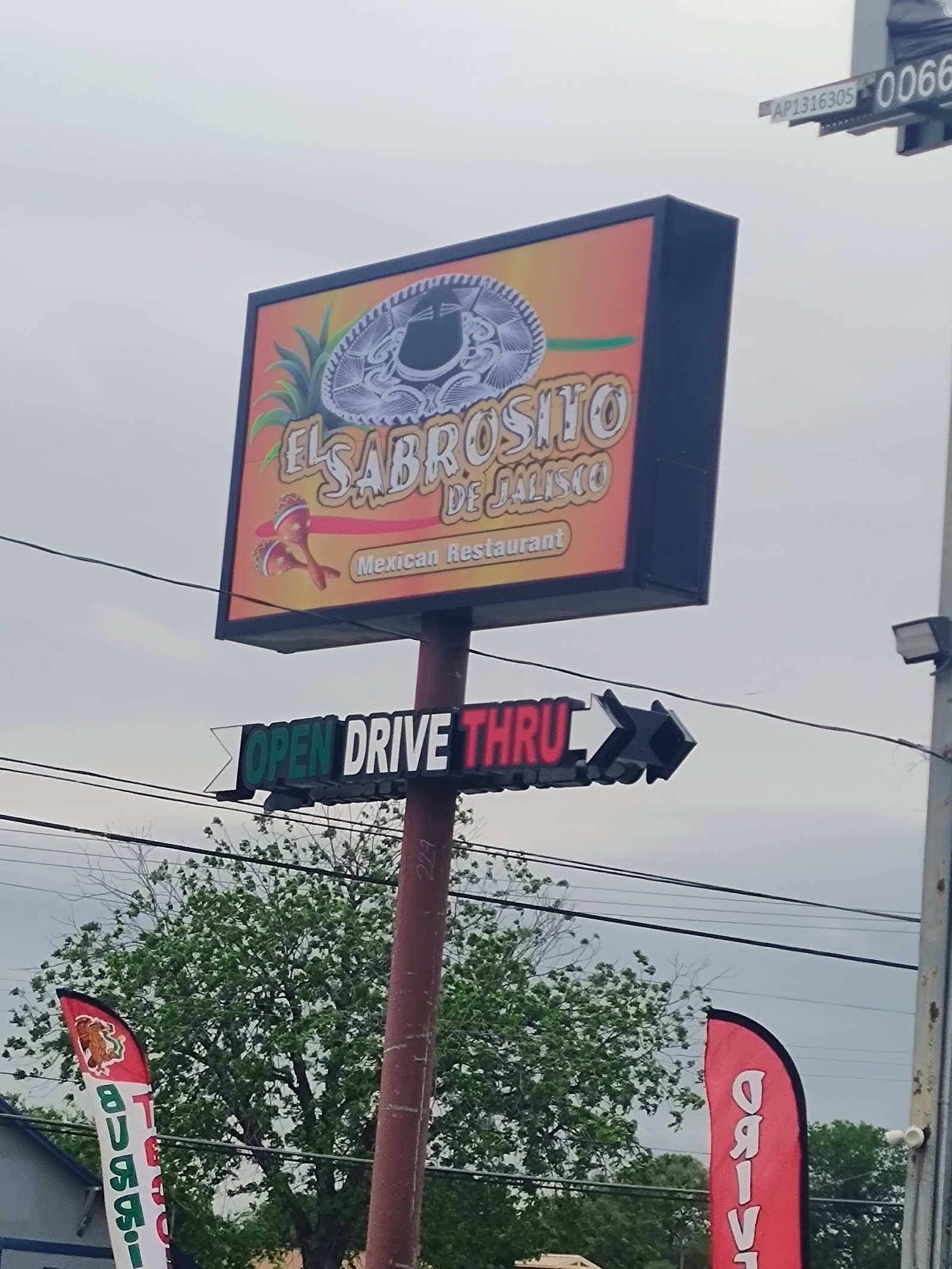 El Sabrosito de Jalisco Mexican Restaurant road sign with open drive-thru light