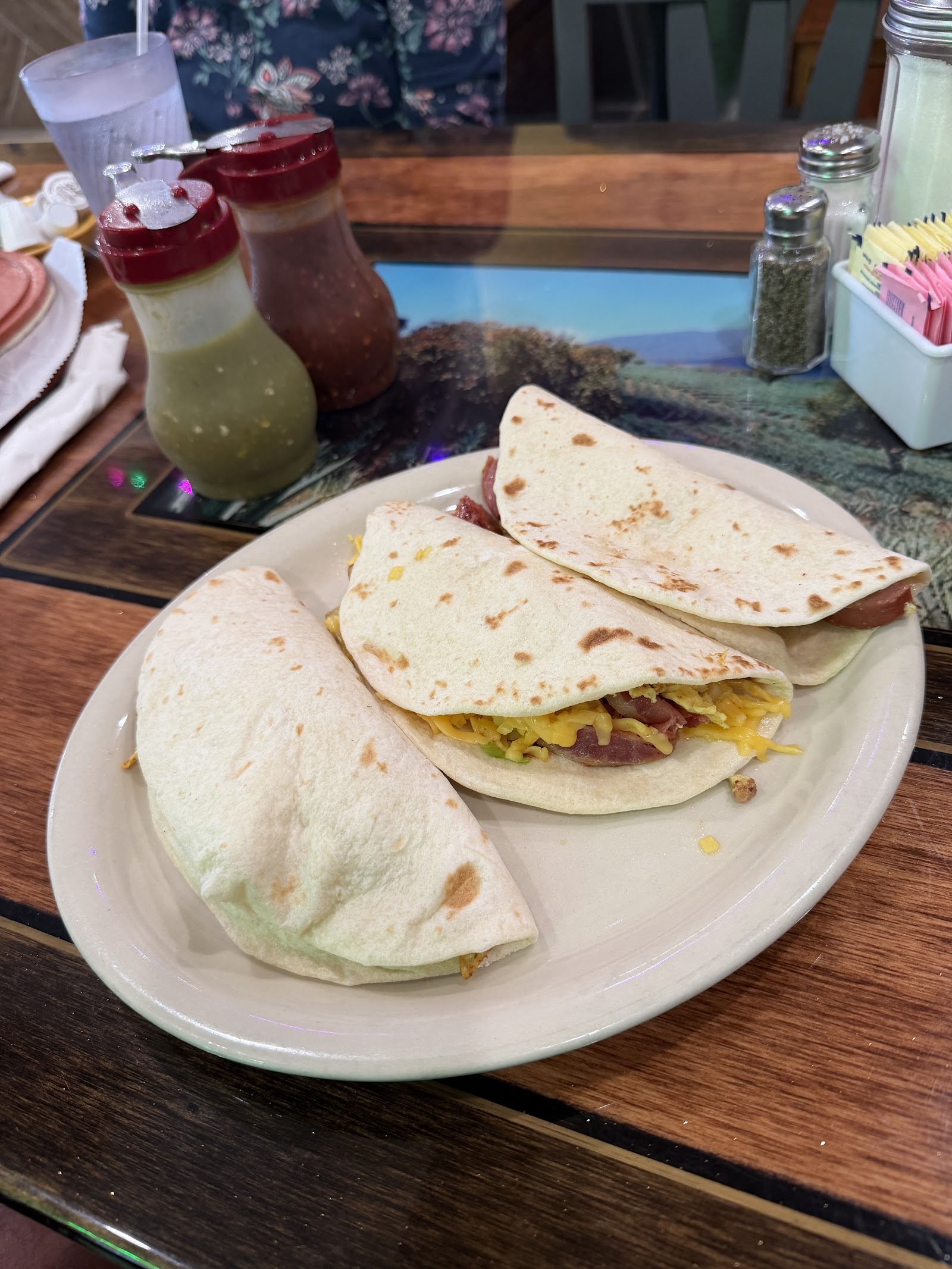 Breakfast tacos with bacon, egg, and cheese on handmade tortillas